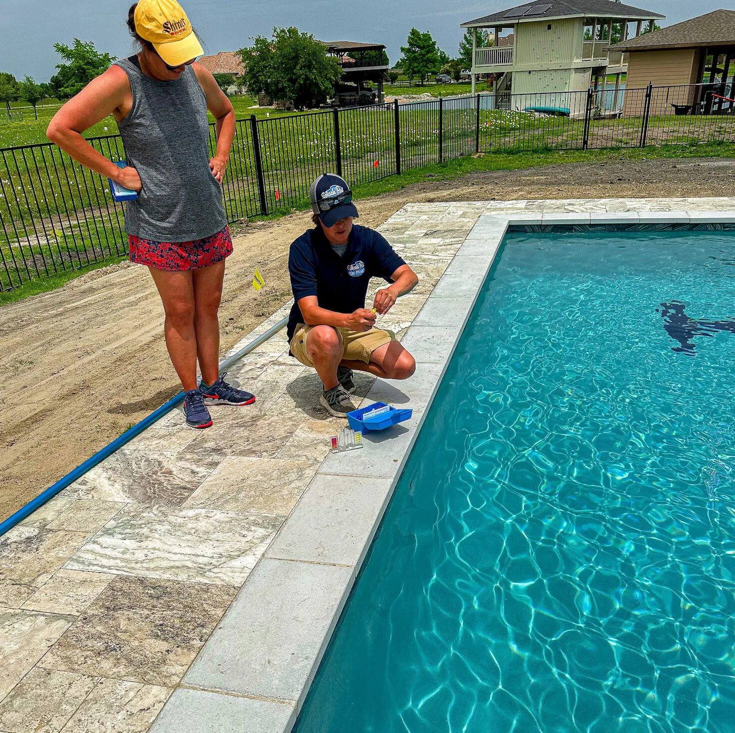 Pool Builder Training Homeowner on Pool Maintenance